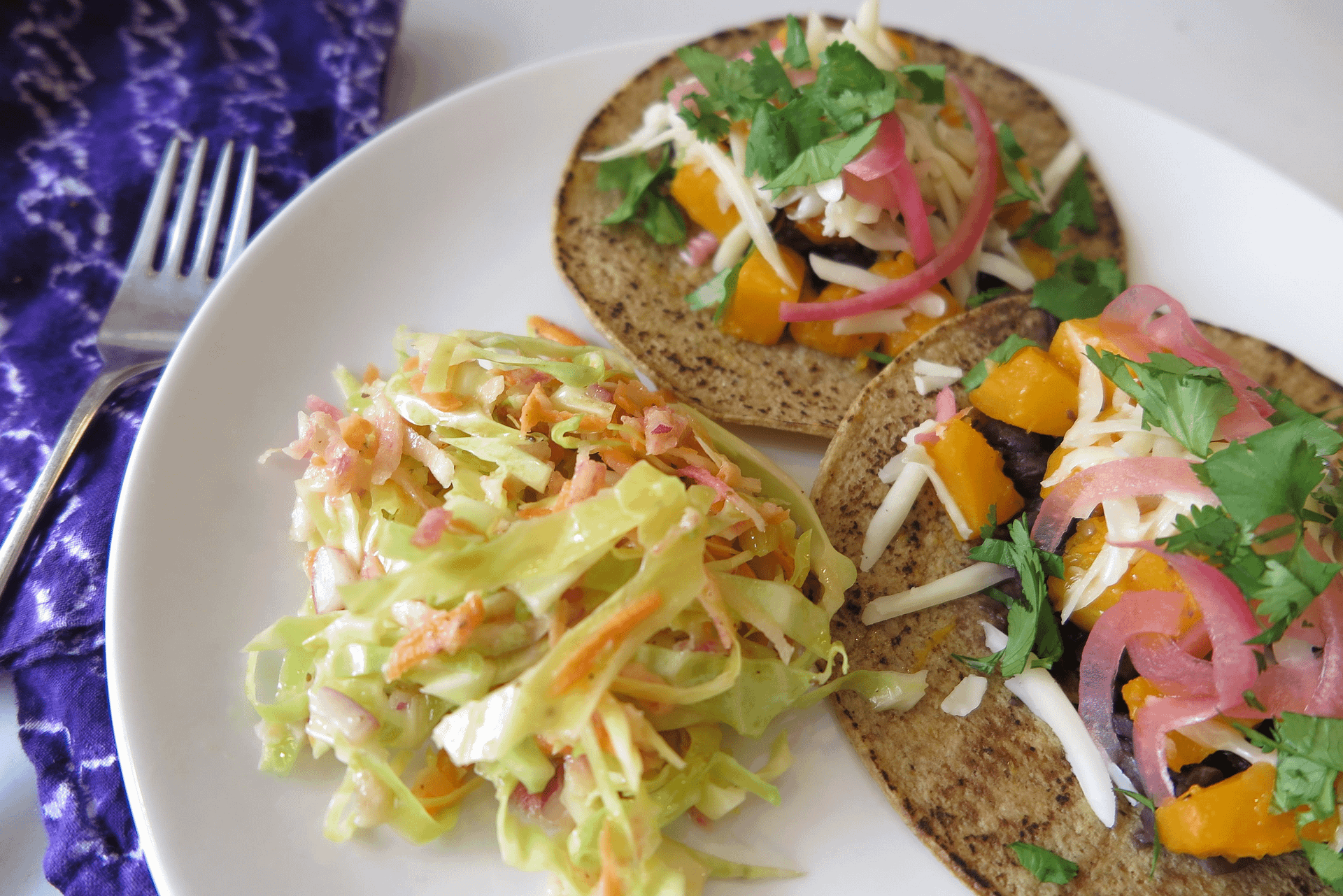 Tacos on a plate with slaw