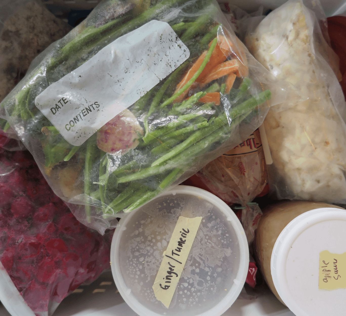 Overhead shot of bags and containers in a freezer drawer