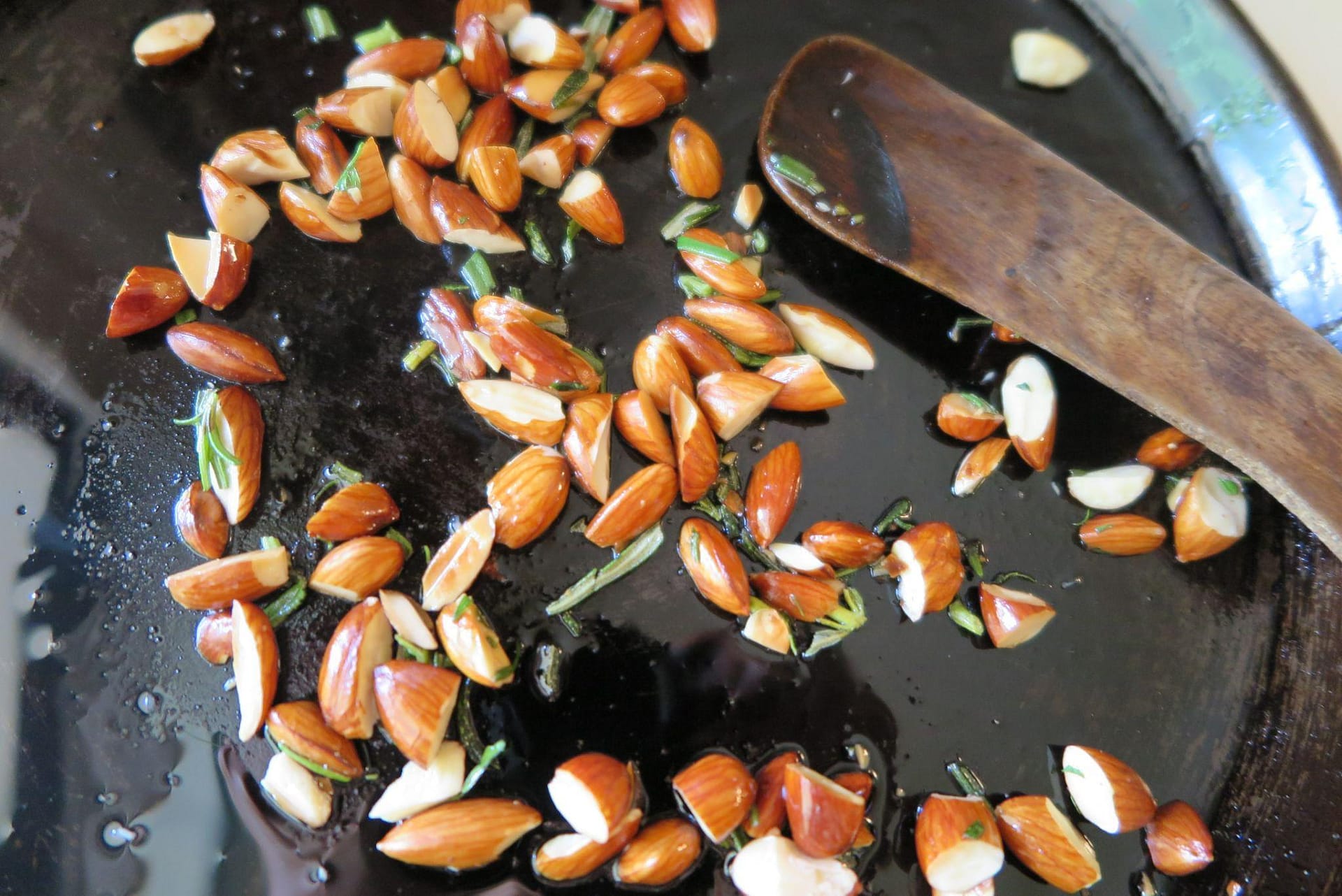 Chopped almonds in a cast iron skillet